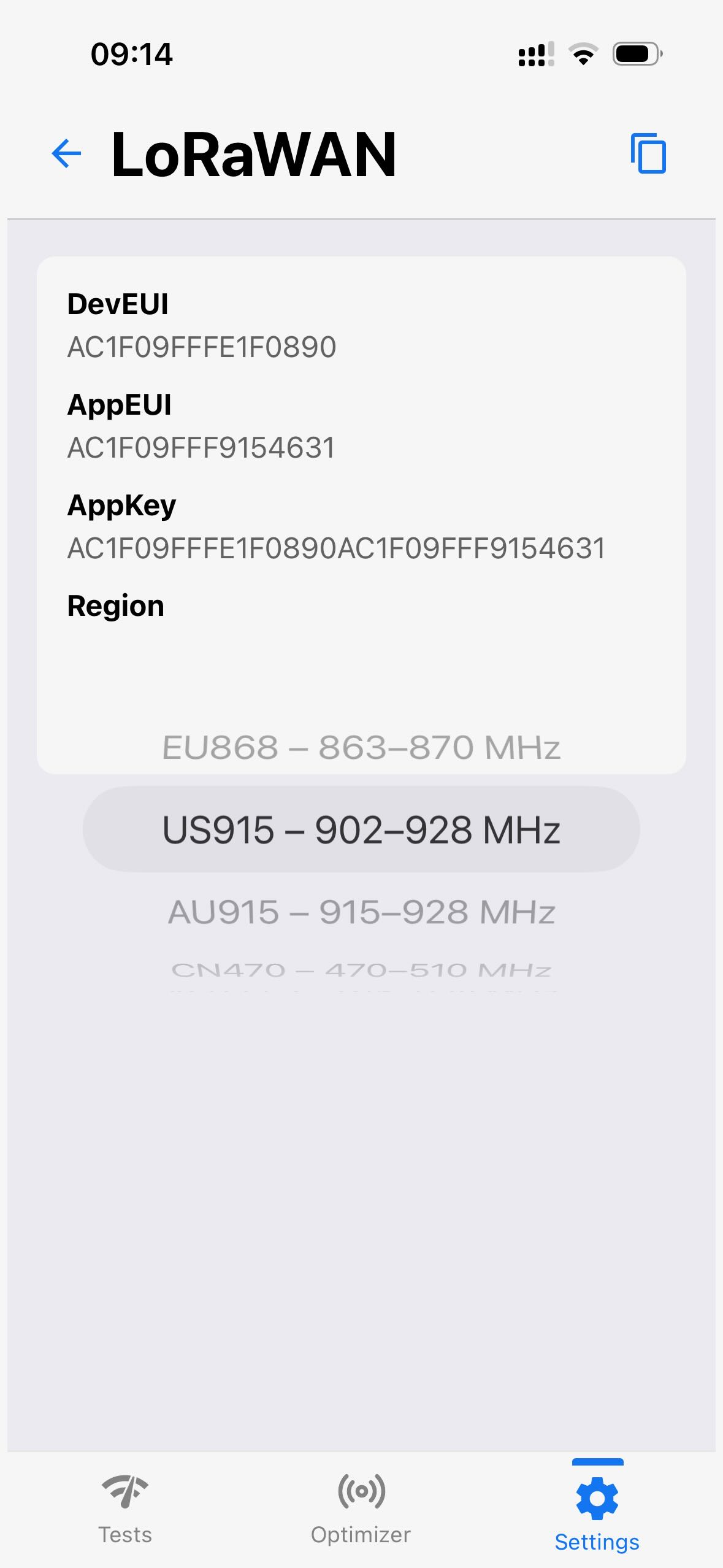 Écran LoRaWAN de l'application Loptimizer avec les champs DevEUI, AppEUI et AppKey, et un sélecteur de région réglé sur US915.
